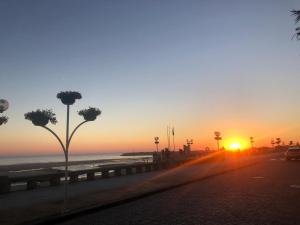 a sunset on a road near the beach at Ancoravilla in Vila Praia de Âncora