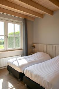 Postel nebo postele na pokoji v ubytování Wertemerhoeve Vakantiewoningen