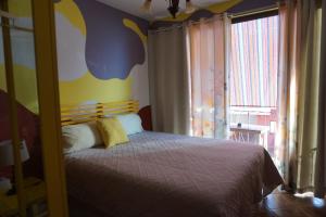 A bed or beds in a room at Accommodation Madre Amada Tenerife