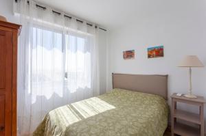 Giường trong phòng chung tại Chez Françoise Fr - Spacieux appartement vue imprenable avec ascenseur