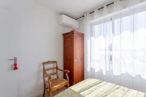 Giường trong phòng chung tại Chez Françoise Fr - Spacieux appartement vue imprenable avec ascenseur