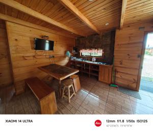 TV a/nebo společenská místnost v ubytování HelChiloé Cabañas + 37 fotografií