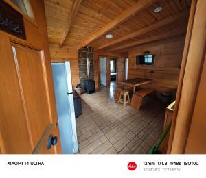 TV a/nebo společenská místnost v ubytování HelChiloé Cabañas