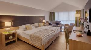 Postel nebo postele na pokoji v ubytování Hotel Holl