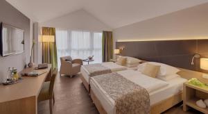 Postel nebo postele na pokoji v ubytování Hotel Holl