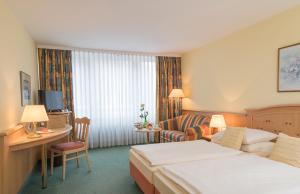 Postel nebo postele na pokoji v ubytování Hotel Holl