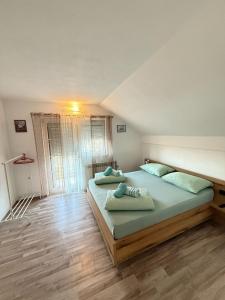 Postel nebo postele na pokoji v ubytování Apartments Marija