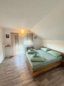 Postel nebo postele na pokoji v ubytování Apartments Marija