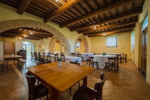 a large dining room with tables and chairs at Laghi di Faldo in Montone