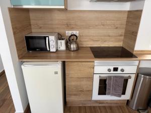 Kuchyňa alebo kuchynka v ubytovaní Apartamento Avenida Principal II
