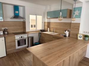 Kuchyňa alebo kuchynka v ubytovaní Apartamento Avenida Principal II