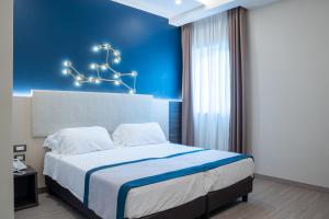 A bed or beds in a room at San Lorenzo - Boutique Hotel & SPA