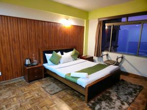 Postel nebo postele na pokoji v ubytování Royal Vista - Guest House
