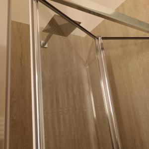 a shower with a shower head in a bathroom at Dante Alighieri 528 in Bari