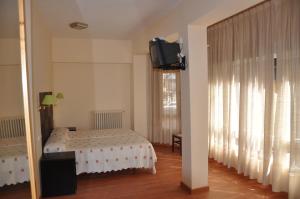 Postel nebo postele na pokoji v ubytování Hostal Ruiz