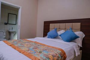 Ліжко або ліжка в номері Benru Suites Hotel +5 фото