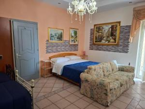 Posteľ alebo postele v izbe v ubytovaní B&B Batarà - "La Terrazza del Centro"