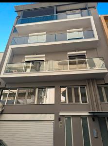 an apartment building with a garage at Luxury 2 storey 2bedroom condo with Private Jacuzzi & patio - Athens in Athens