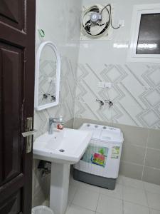 a bathroom with a sink and a mirror at Welcome Two 5km far from Masjid Nabawi in Al Madinah +13 photos