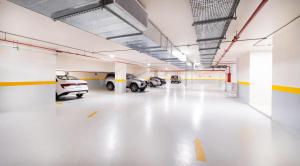 a large parking garage with cars parked in it at Dancenter Jeddah Near King Fahd's Fountain in Jeddah +57 photos