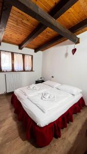 Postel nebo postele na pokoji v ubytování Silvydolomitiapartment