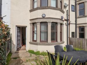 a house with a clock on the side of it at Mayfield Manor in Whitby