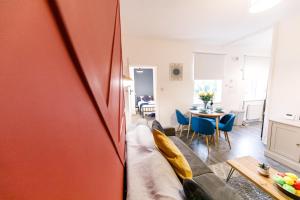 a living room with a couch and a table at 3 Bedroom Home Free Parking & WiFi Contractors Welcome! in Pallion