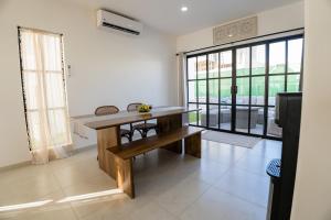a kitchen with a wooden table in a room at Cabo San Lucas House, 2Bedroom, 2Bathrooms,Pool, Rooftop views in El Pueblito