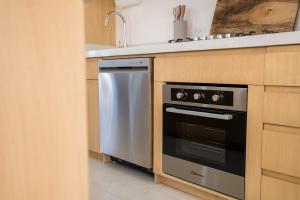 a kitchen with a stainless steel oven and a sink at Cabo San Lucas House, 2Bedroom, 2Bathrooms,Pool, Rooftop views in El Pueblito