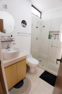 a bathroom with a toilet and a sink and a shower at Cabo San Lucas House, 2Bedroom, 2Bathrooms,Pool, Rooftop views in El Pueblito +36 photos