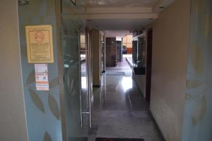 a hallway of a building with a sign on the wall at Hotel Tacuba in Mexico City
