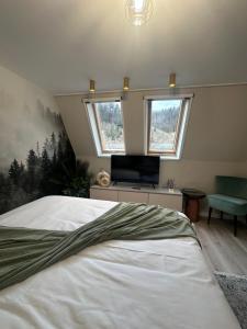 Postel nebo postele na pokoji v ubytování Alpin Heaven