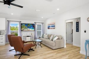 a living room with a couch and a table at Anchors Away by Sun Palace Vacations in Fort Myers Beach