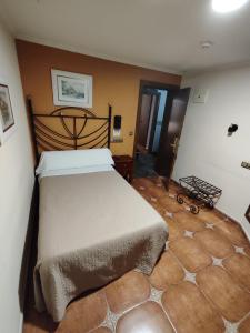 Postel nebo postele na pokoji v ubytování Hostal La Posada