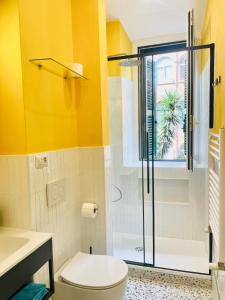 a bathroom with a toilet and a shower at Rome to You- Easy way Apartment in Rome