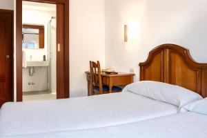 Postel nebo postele na pokoji v ubytování Hotel Cabeza