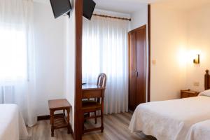 Postel nebo postele na pokoji v ubytování Hotel Cabeza
