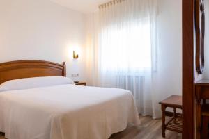 Postel nebo postele na pokoji v ubytování Hotel Cabeza