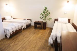 Postel nebo postele na pokoji v ubytování Medova Pechera