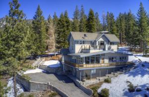 an aerial view of a house in the snow at Enviable Lake & Mountain Views Wth Waterfall in South Lake Tahoe
