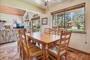 a dining room with a wooden table and chairs at Minutes From Heavenly Valley Lake Tahoe Beaches in South Lake Tahoe
