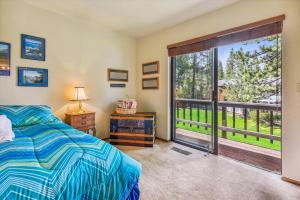 a bedroom with a bed and a large window at Minutes From Heavenly Valley Lake Tahoe Beaches in South Lake Tahoe