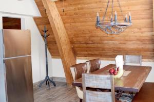 a dining room with a table and a chandelier at Beautiful Views Of Mt Quandary Off Private Balcony in Breckenridge