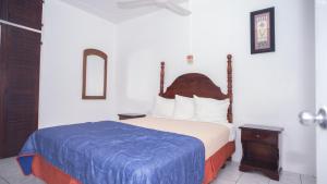 Ein Bett oder Betten in einem Zimmer der Unterkunft GolfView Hotel