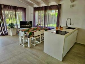a kitchen with a sink and a counter top at White House in Civitanova Marche