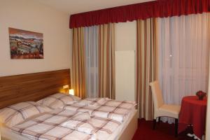 Hotel Garni Daniela Urich客房内的一张或多张床位