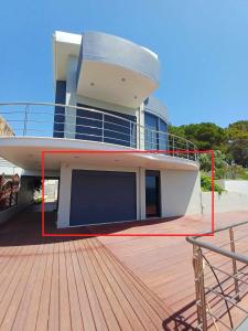 a large boat sitting on top of a wooden deck at Casa del Mar in Preveza