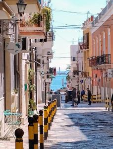 a street in positano with a view of the ocean at B&B La Casa Di Bianca in Manfredonia