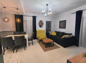 a living room with a couch and a table at Perła Górska in Szklarska Poręba