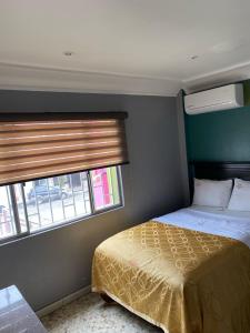 Postel nebo postele na pokoji v ubytování Hotel Yolanda